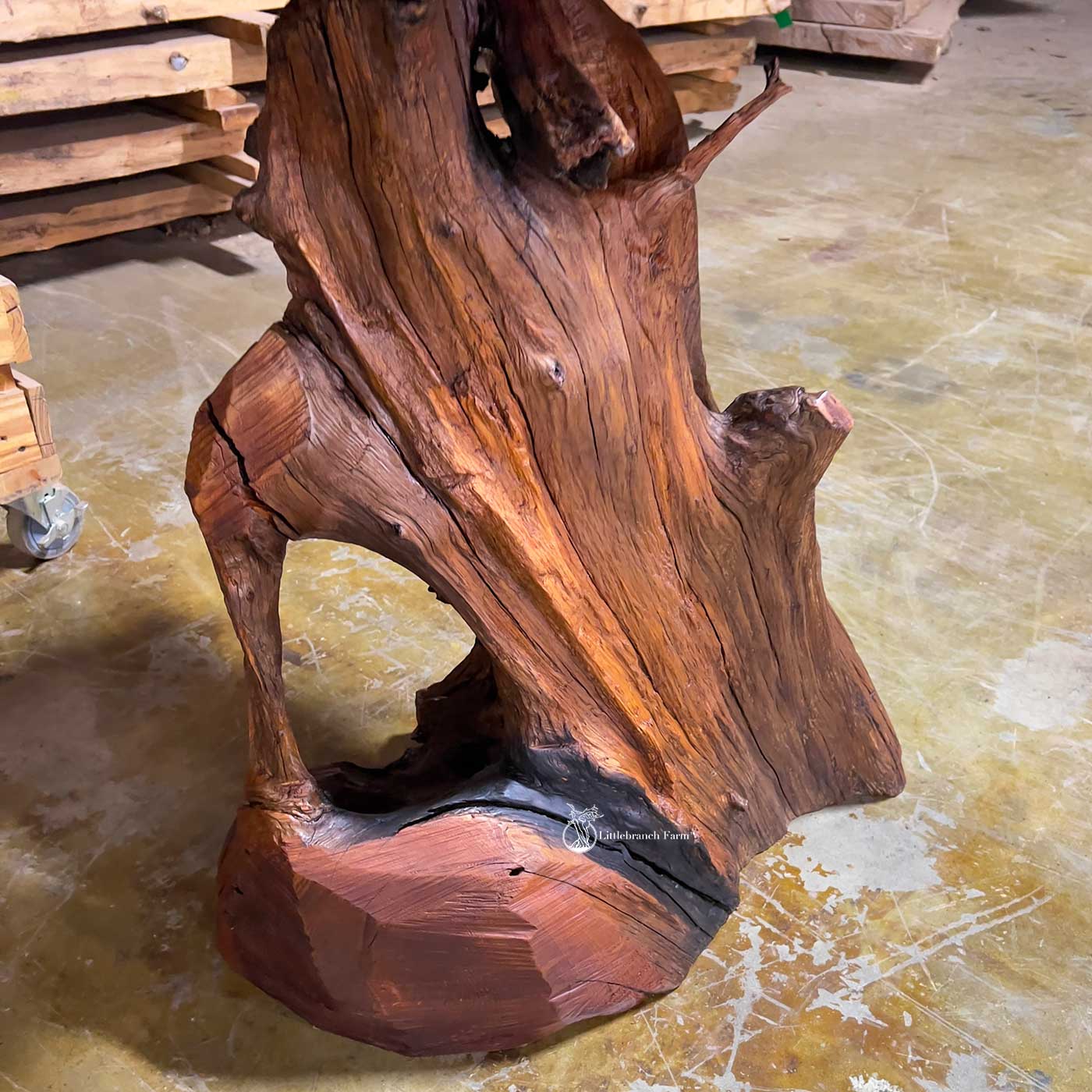 Western cedar root base supporting handcrafted sinker cypress vanity.