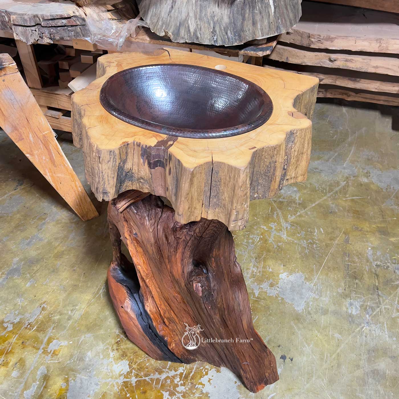 Hammered copper sink set into solid sinker cypress vanity top.
